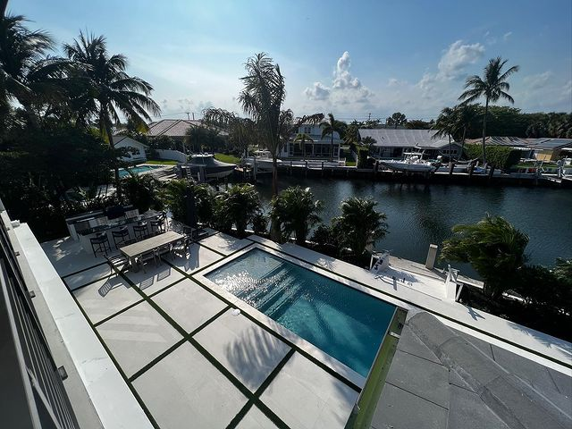 A pool in the backyard of a house
