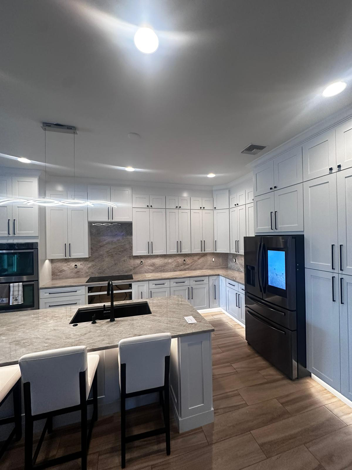 a kitchen space with wooden floors