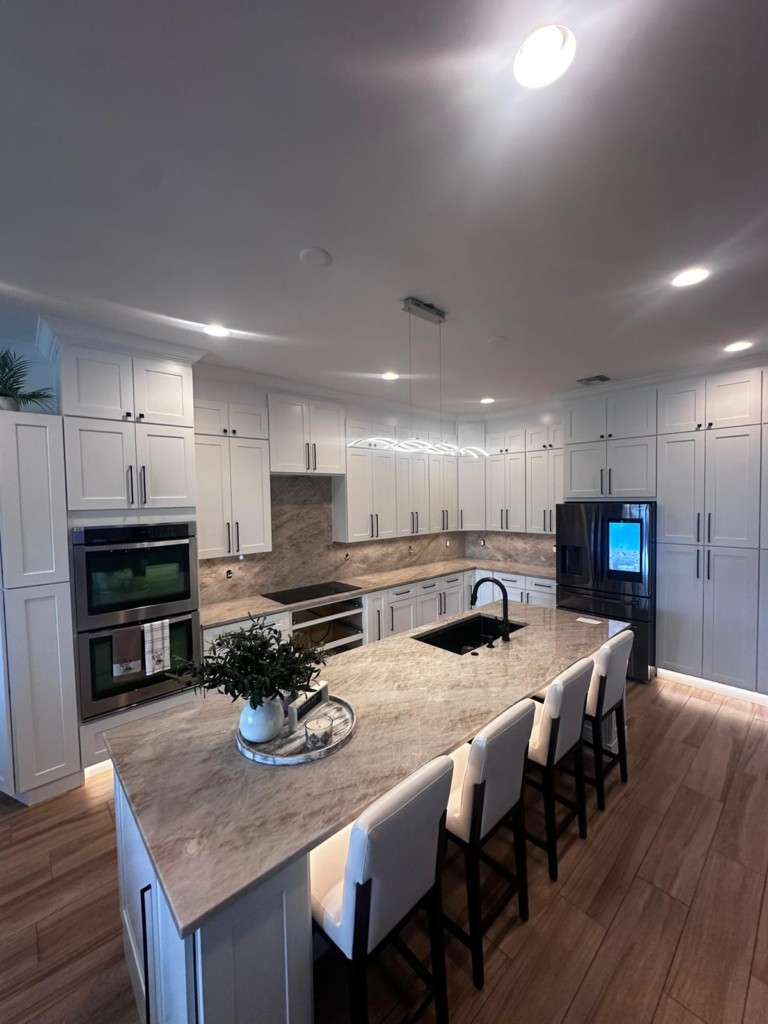 a kitchen with white cabinetry